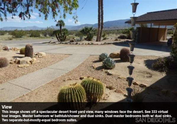 This image shows off a spectacular desert front yard view, many windows face the desert. See 333 virtual tour images. Master bathroom w/ bathtub/shower and dual sinks. Dual master bedrooms both w/ dual sinks. Two separate-but-mostly-equal bedroom suites.