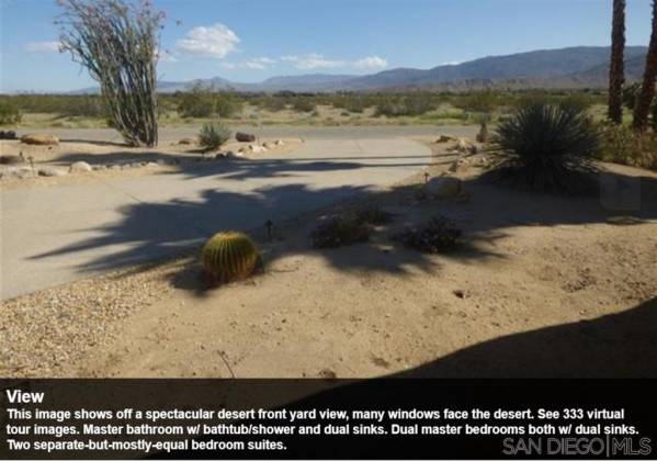 This image shows off a spectacular desert front yard view, many windows face the desert. See 333 virtual tour images. Master bathroom w/ bathtub/shower and dual sinks. Dual master bedrooms both w/ dual sinks. Two separate-but-mostly-equal bedroom suites.