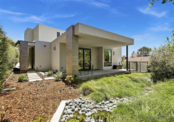 Lush landscaping. Generous covered patio at 322.