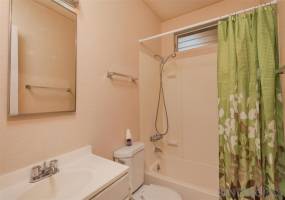 Full bathroom with tub and shower.